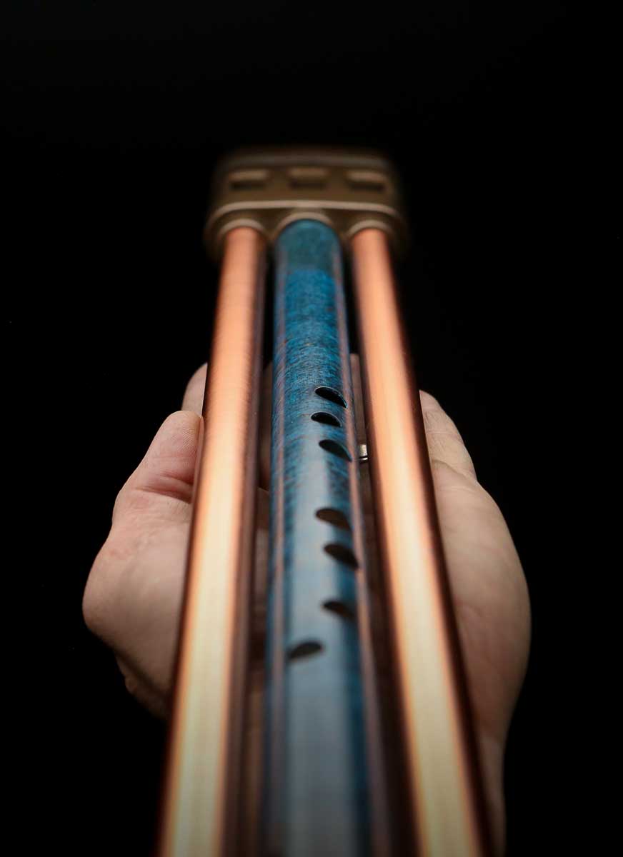 Full length view of the Copper Flute Triune highlighting its vertical form
